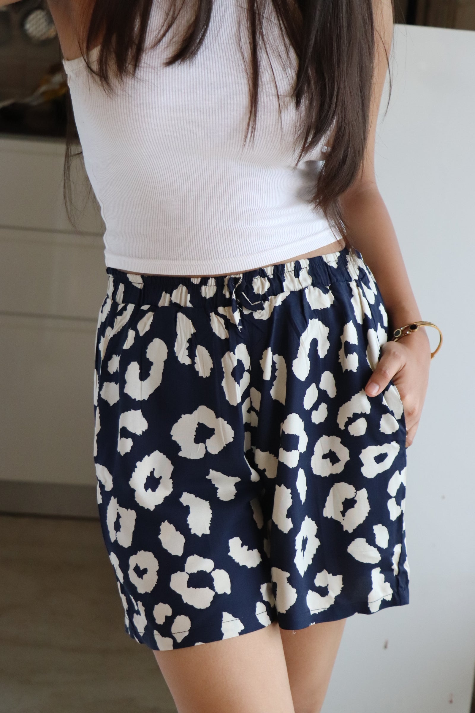 Navy Abstract Viscose shorts with leopard print, featuring an elastic waistband and pockets for comfort and style.