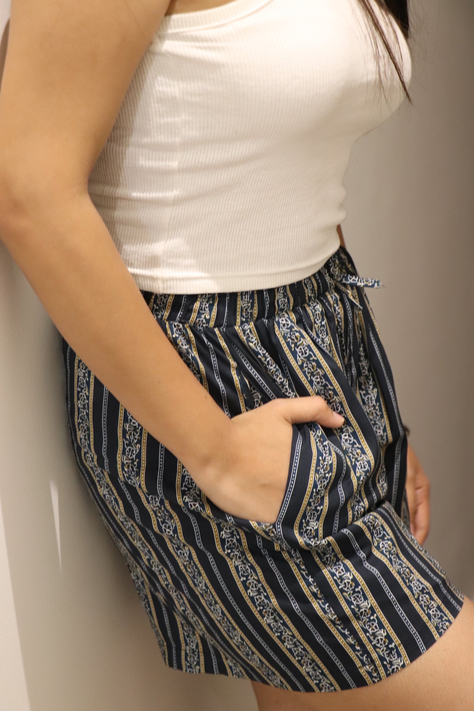 Navy stripe viscose shorts featuring an elastic waistband and pockets, perfect for lounging or sleepwear.