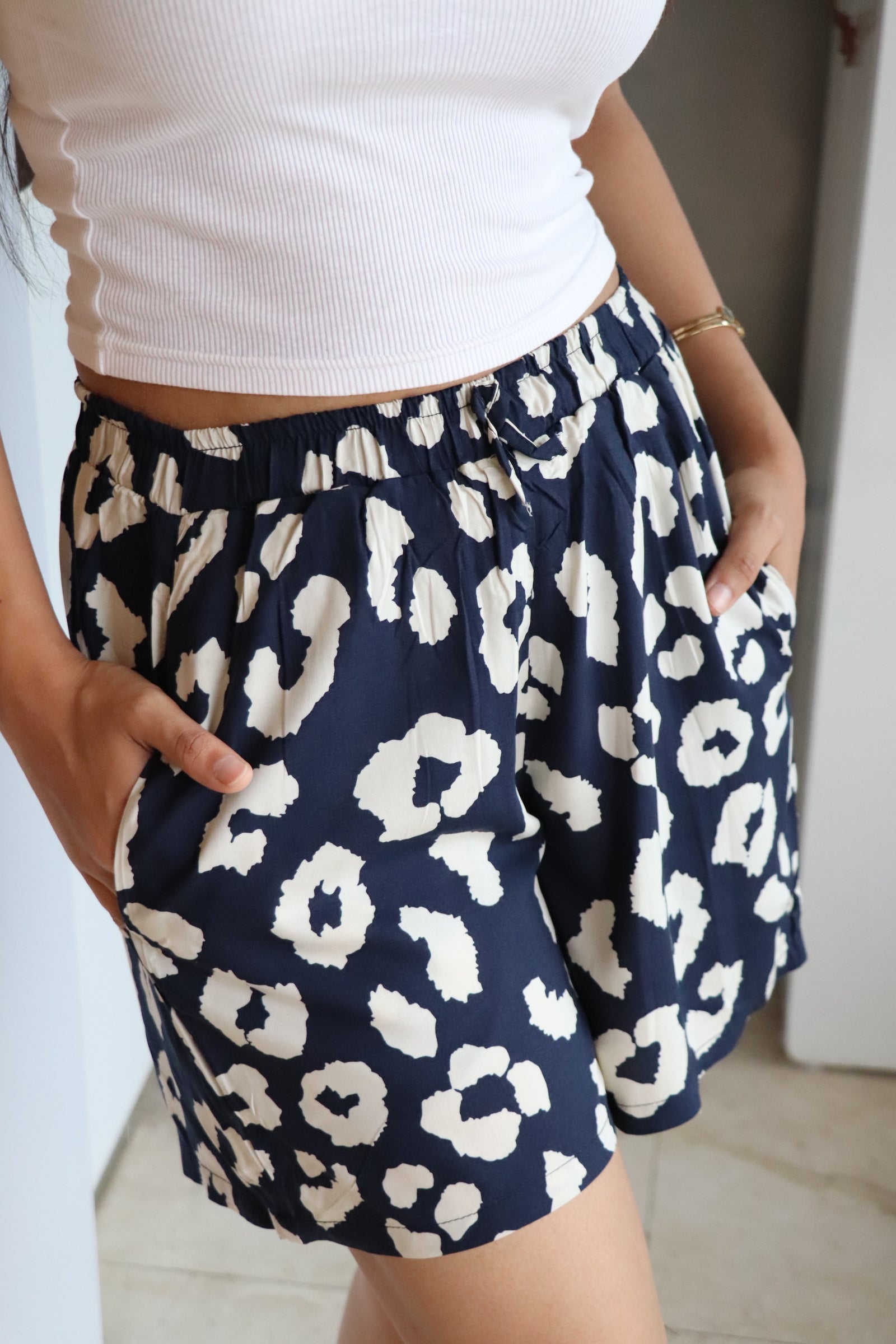 Navy abstract viscose shorts with elastic waistband and pockets, perfect for lounging or sleepwear.